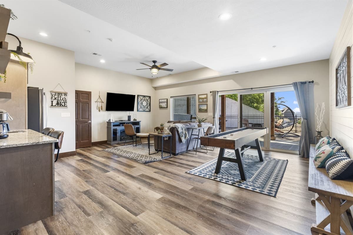 Lower level living room with PS4 and shuffleboard table