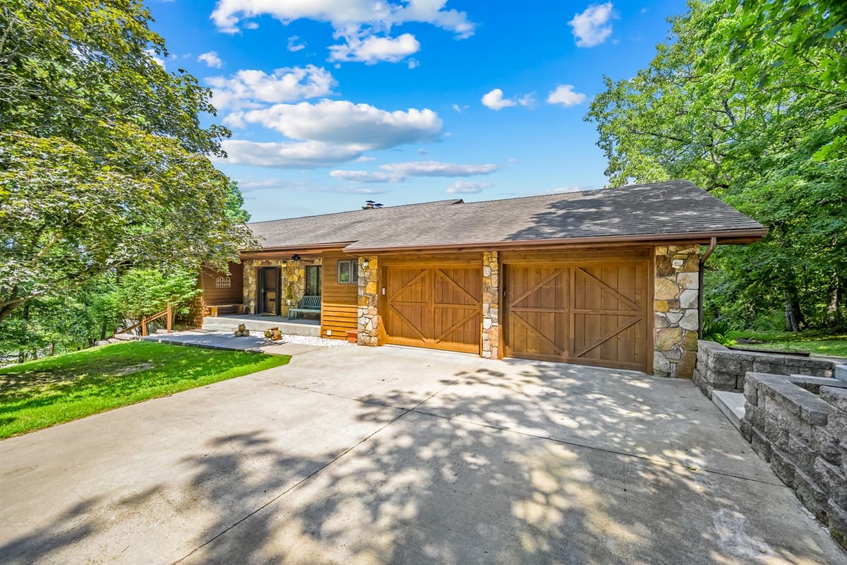 Two car garage and parking space for lots of vehicles.  There are 2 additional parking pads as well as a very long driveway.