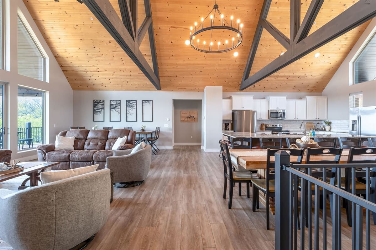 Open concept living room with tons of seating and space + a great view!