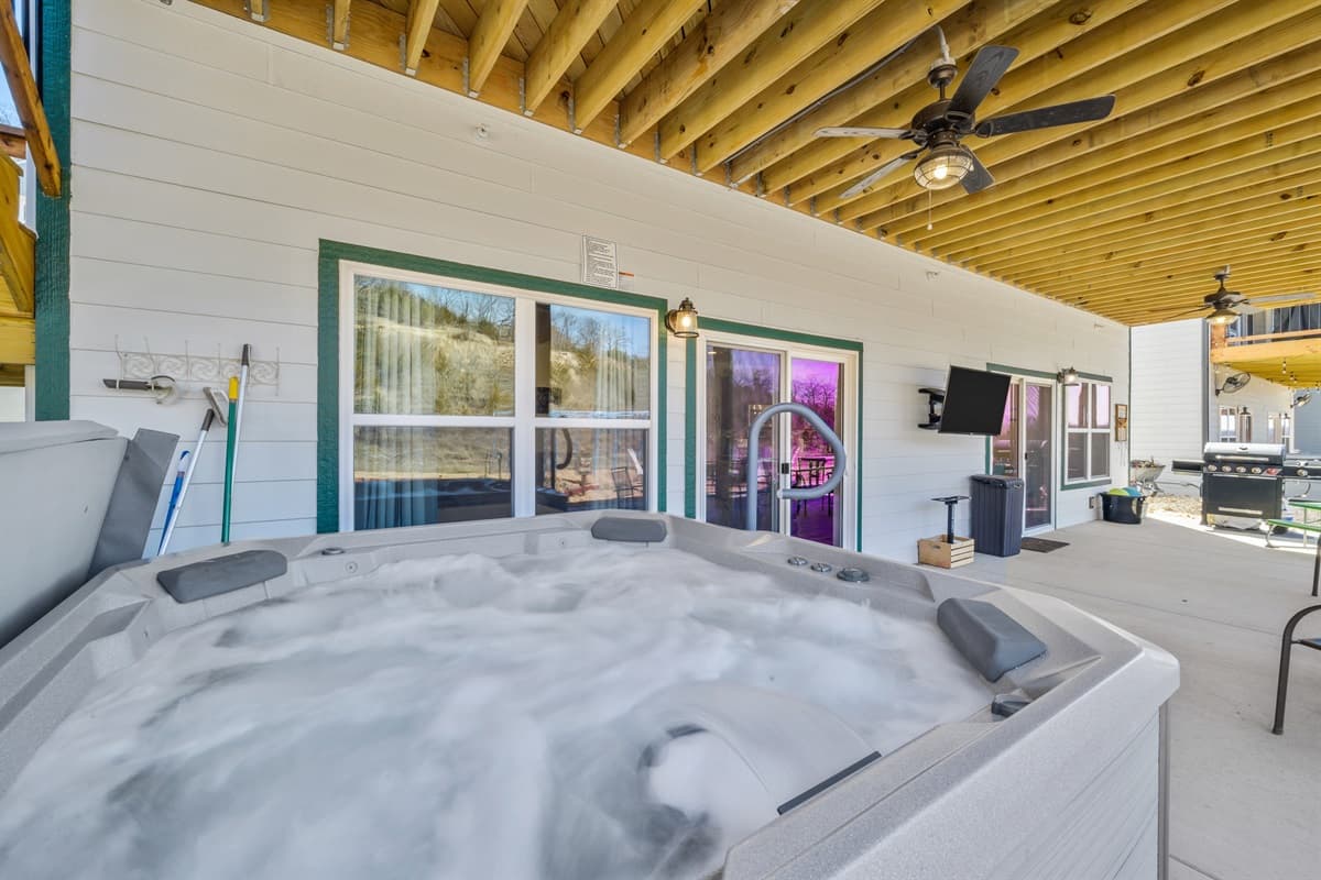 Relax your cares away in the private hot tub