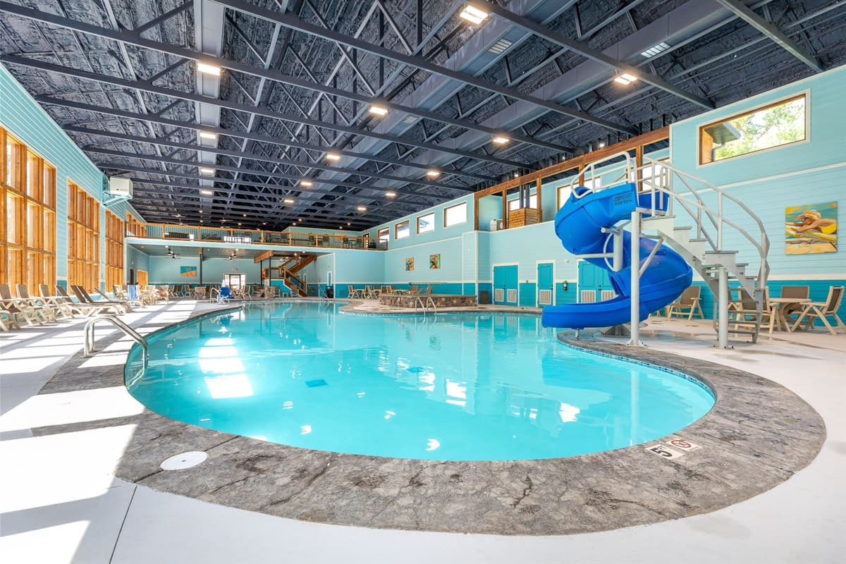 Community indoor pool with slide and hot tub!