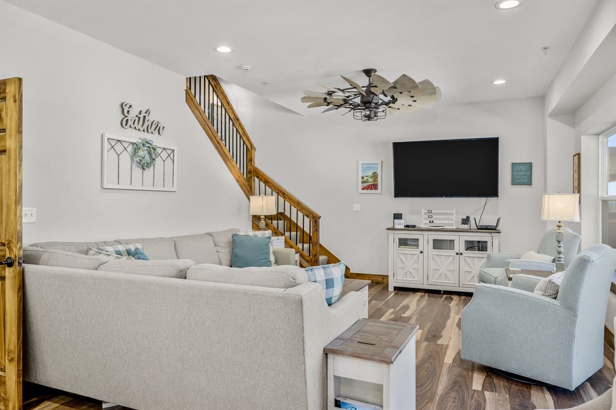 Main living area with 65" smart TV and DVD player