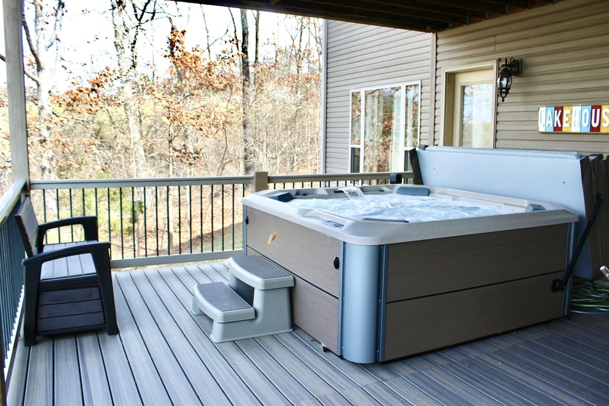 Enjoy your own private hot tub surrounded by nature on the lower deck overlooking the lake!