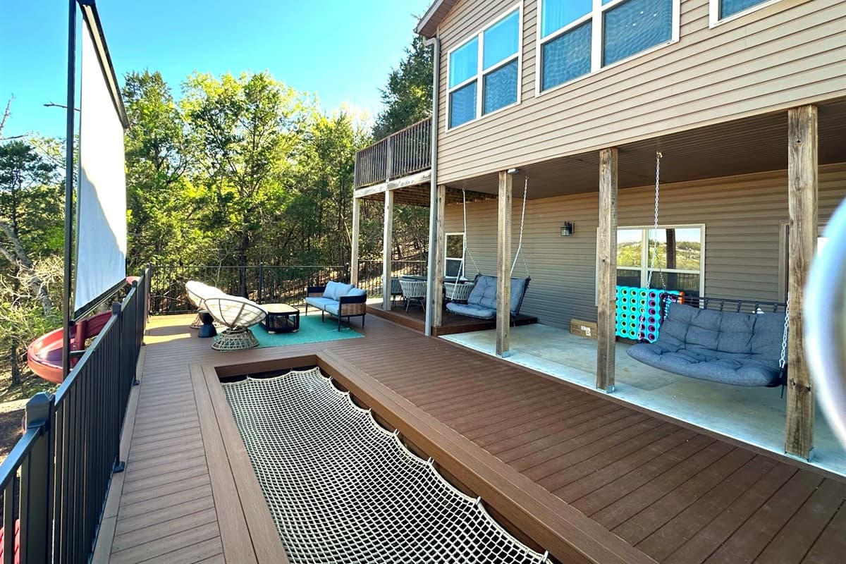 Sit outside and watch a movie from the back deck! New outdoor theatre screen and hammock!